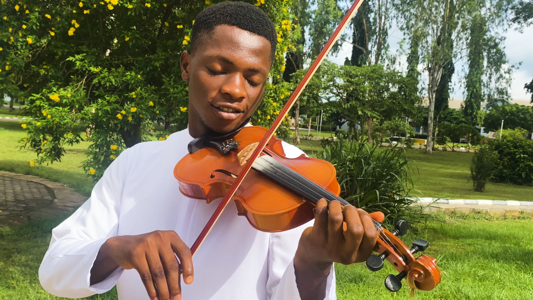Seminarian violinist, Celestine Emenike playing the interlude to Onye Oluebube